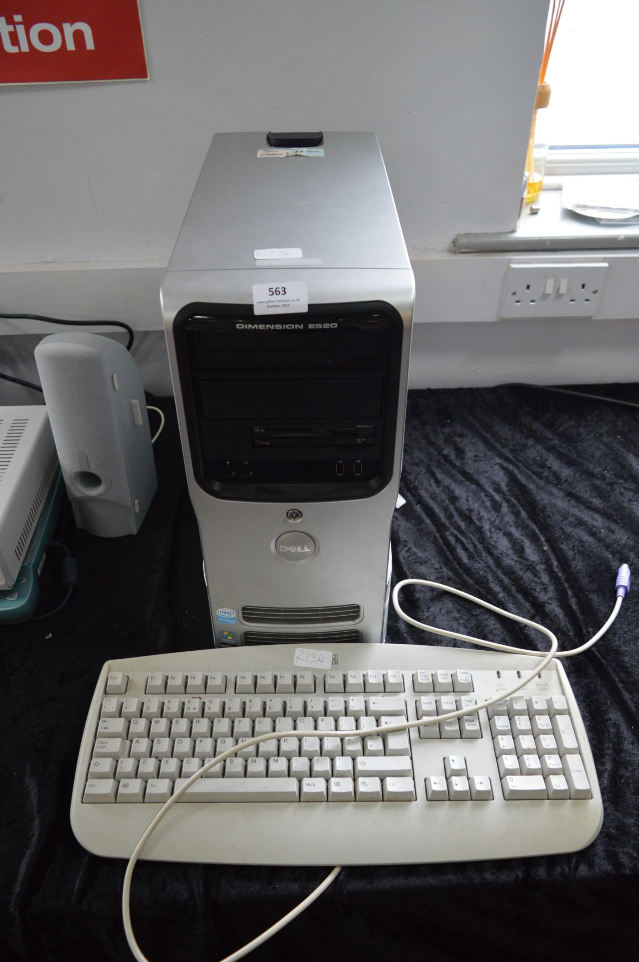 Dell Dimension E520 Computer Tower and a Keyboard