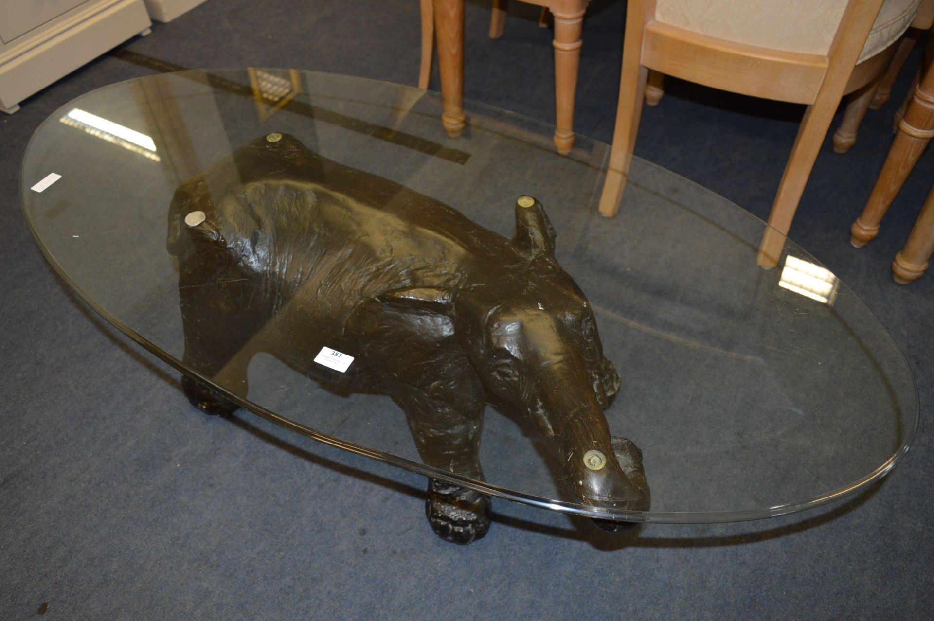 Oval Glass Topped Coffee Table with Elephant Base