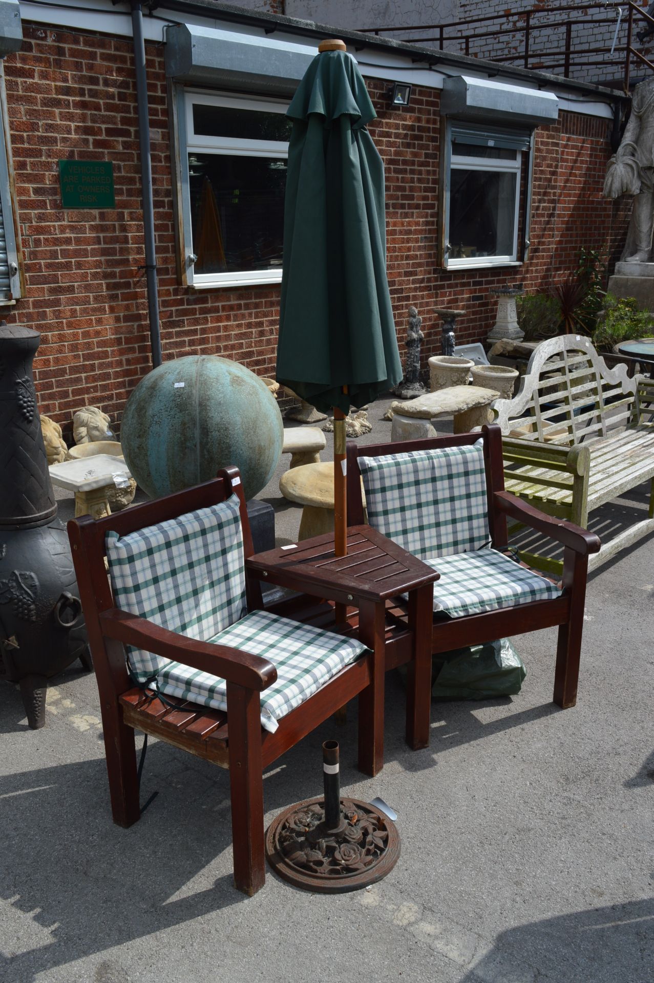 Twin Seat Wooden Garden Bench and an Umbrella