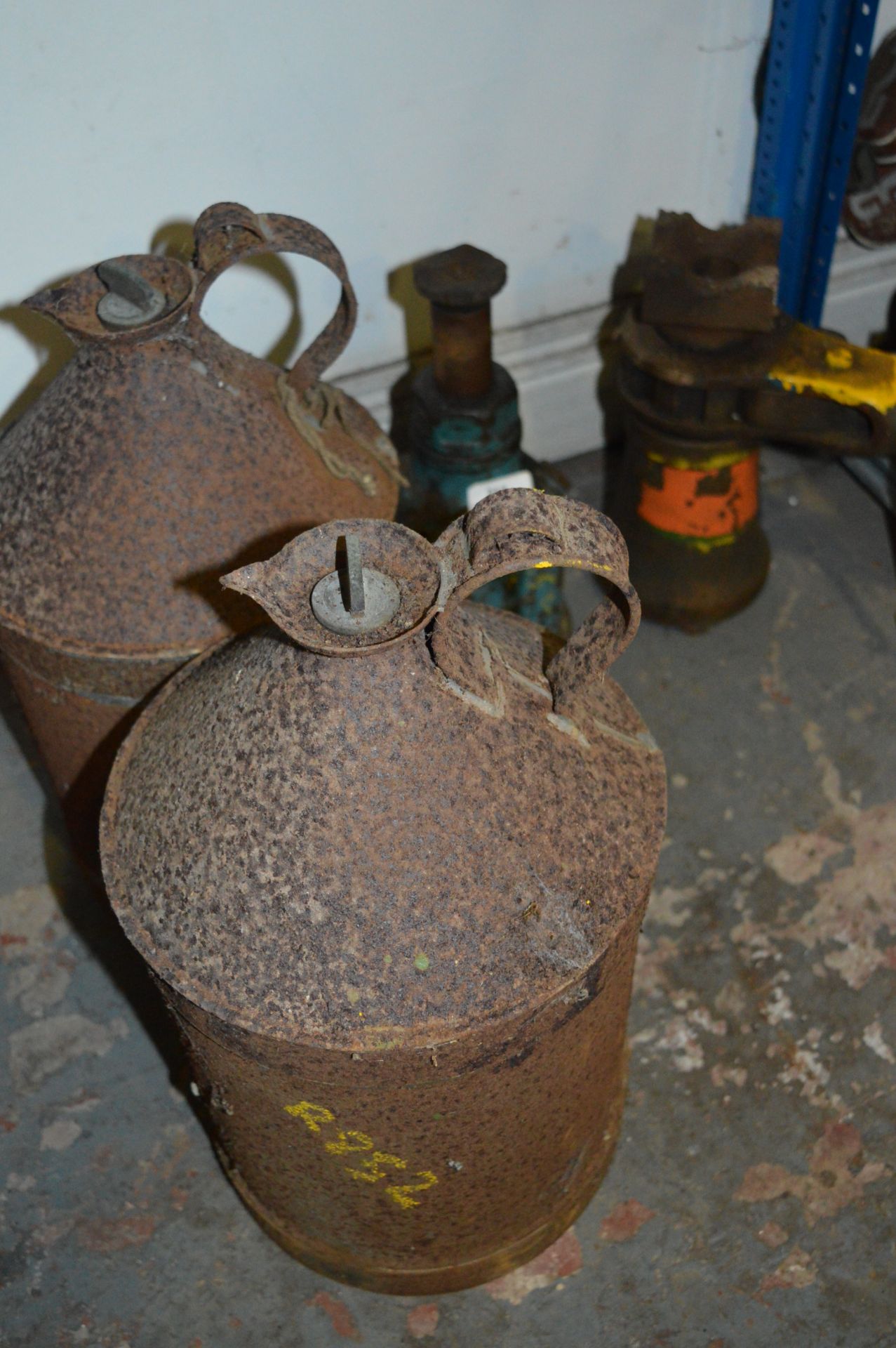 Two Bottle Jacks and Two Paraffin Cans