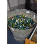 Galvanized Bucket Containing a Large Quantity of Marbles