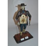 Cast Metal Figurine "Clock Seller"