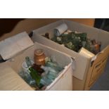 Two Boxes Containing a Large Amount of Aqua Green and Brown Glass Bottles