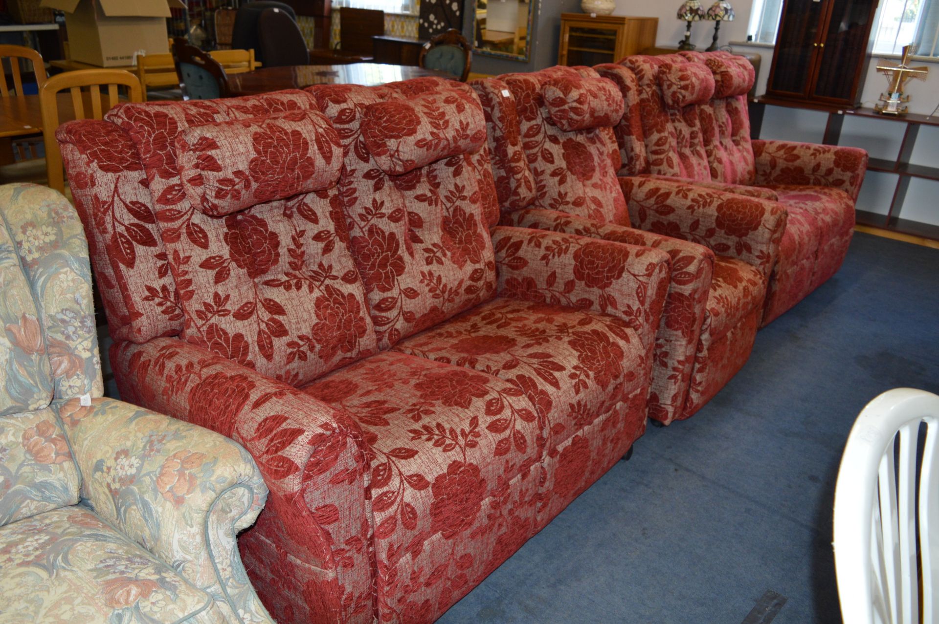 Red Floral Pattern Three Piece Suite; Two Two Seat Sofas and a Armchair