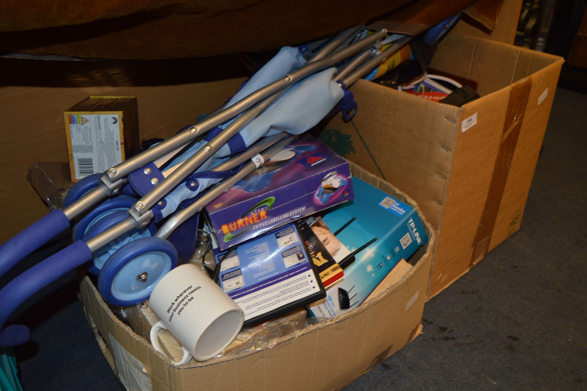 Two Boxes Containing DVD Labeling System, Pushchair, TP Link, Pottery, etc.