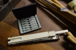 Set of Precision Screwdrivers and a Slide Rule