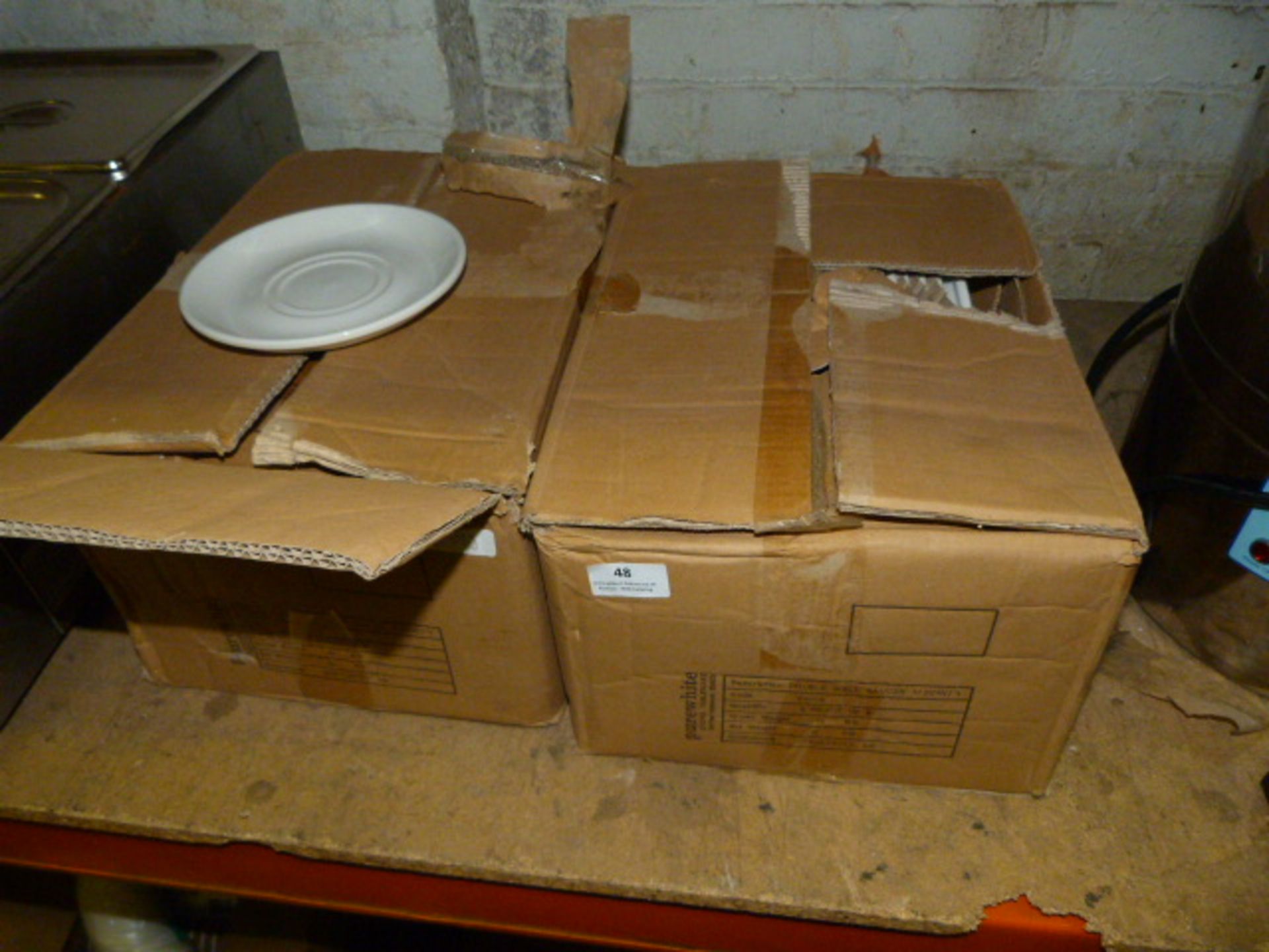 Two Boxes of White Saucers