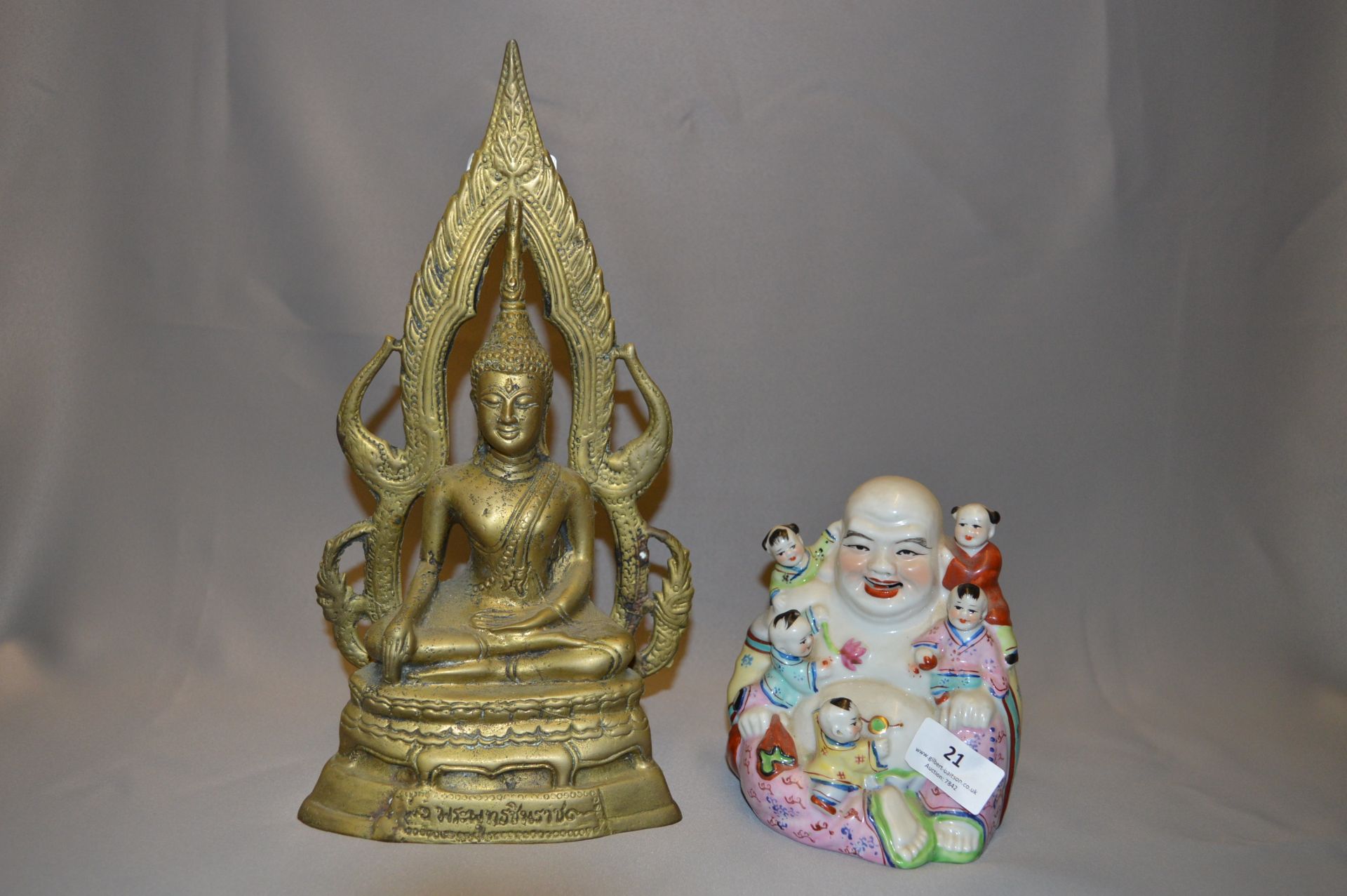 A Brass and a Pottery Buddha Ornaments