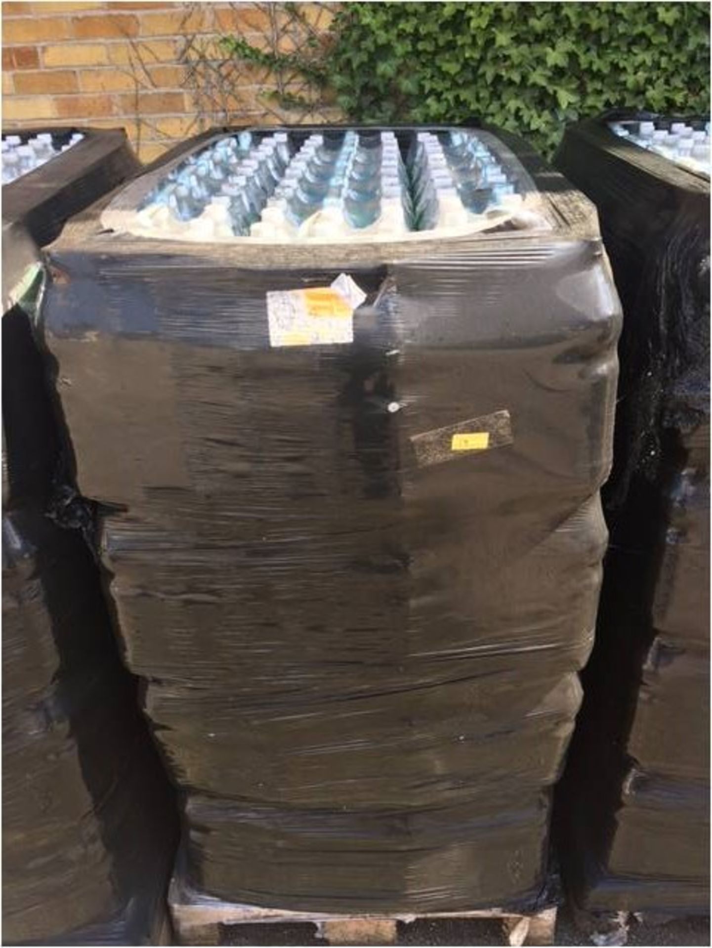 *Pallet Containing Bottles of Spring Water