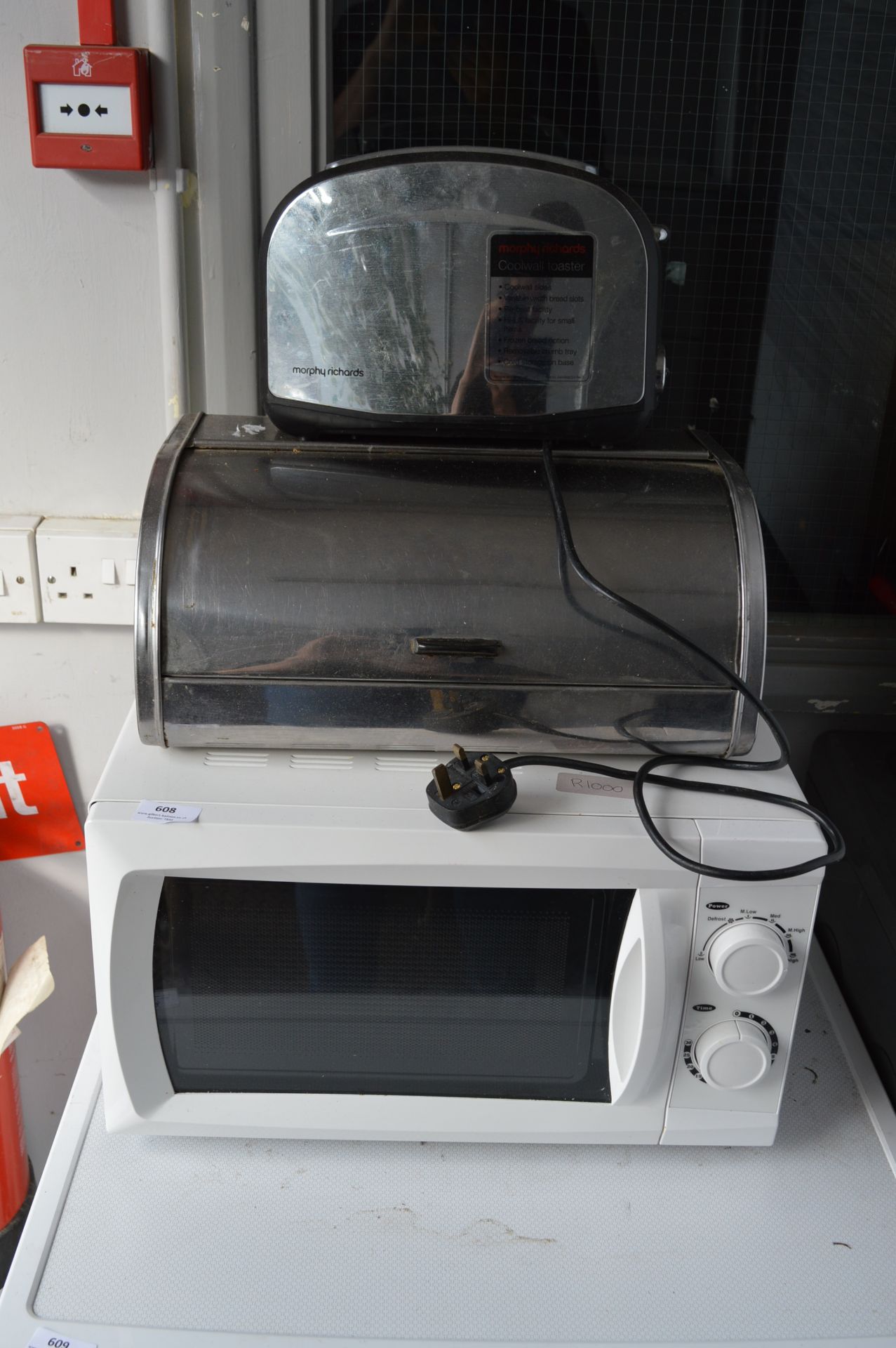 Domestic Microwave Oven, Toaster and a Stainless Steel Bread Bin