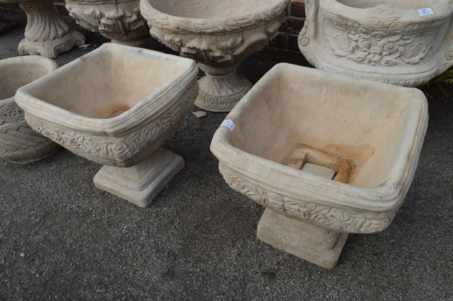 Pair of Reconstituted Limestone Planters with Floral Decoration