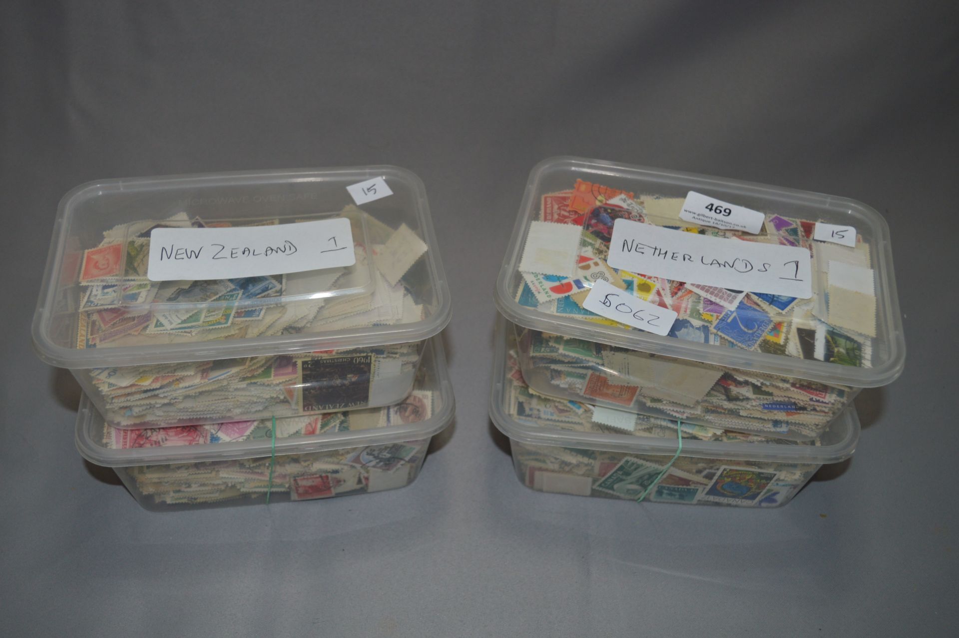 4 Tubs containing Stamps from New Zealand, Italy, Netherlands & Canada