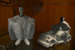 Two Pottery Ornaments "Seated Gent" and "Man with Car"