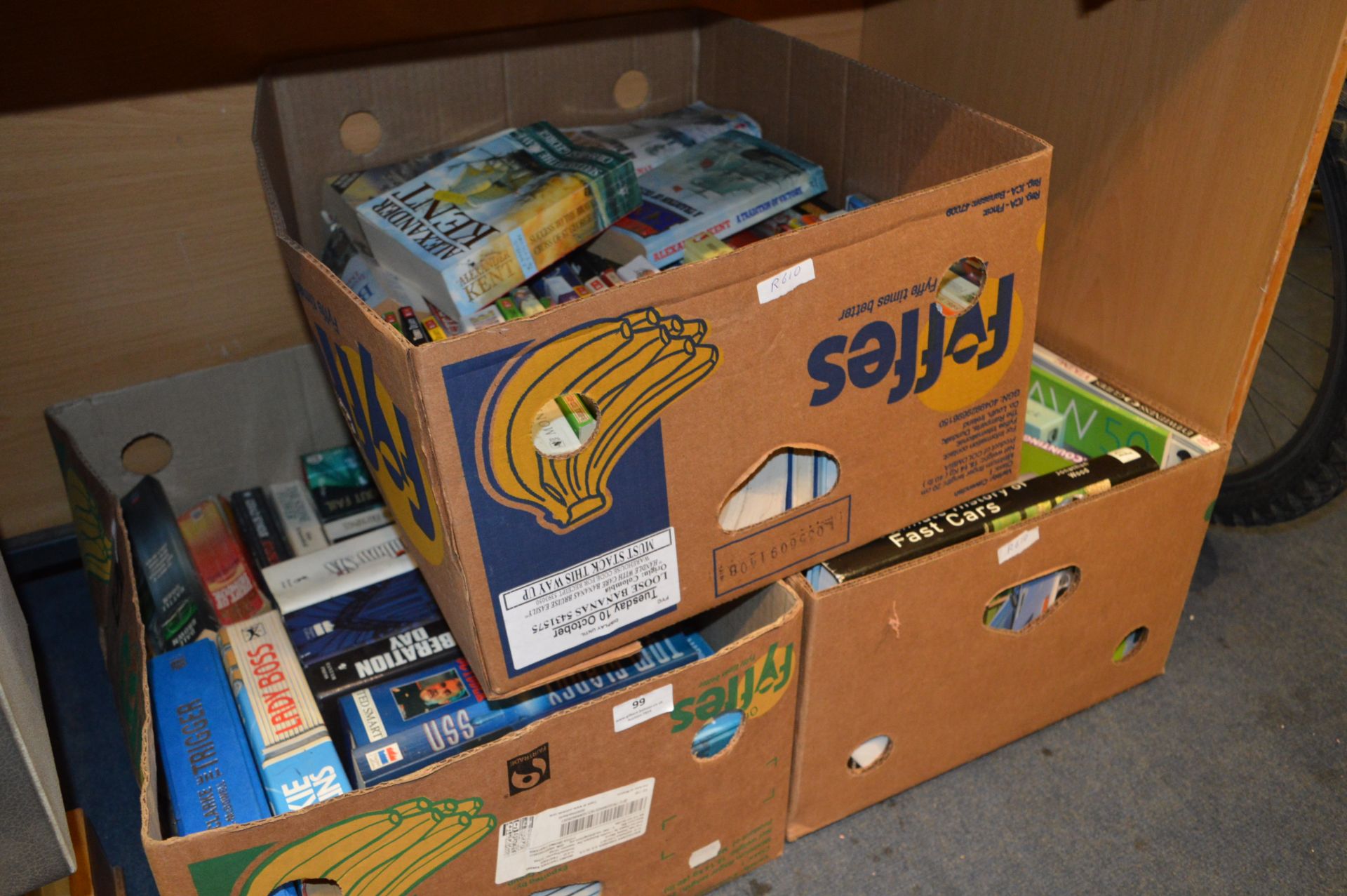 Three Boxes Containing a Large Selection of Books