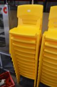 *Twelve Stackable Yellow Plastic Children's Chairs