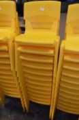 *Twelve Stackable Yellow Plastic Children's Chairs