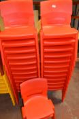 *Twenty Six Stackable Red Plastic Children's Chairs