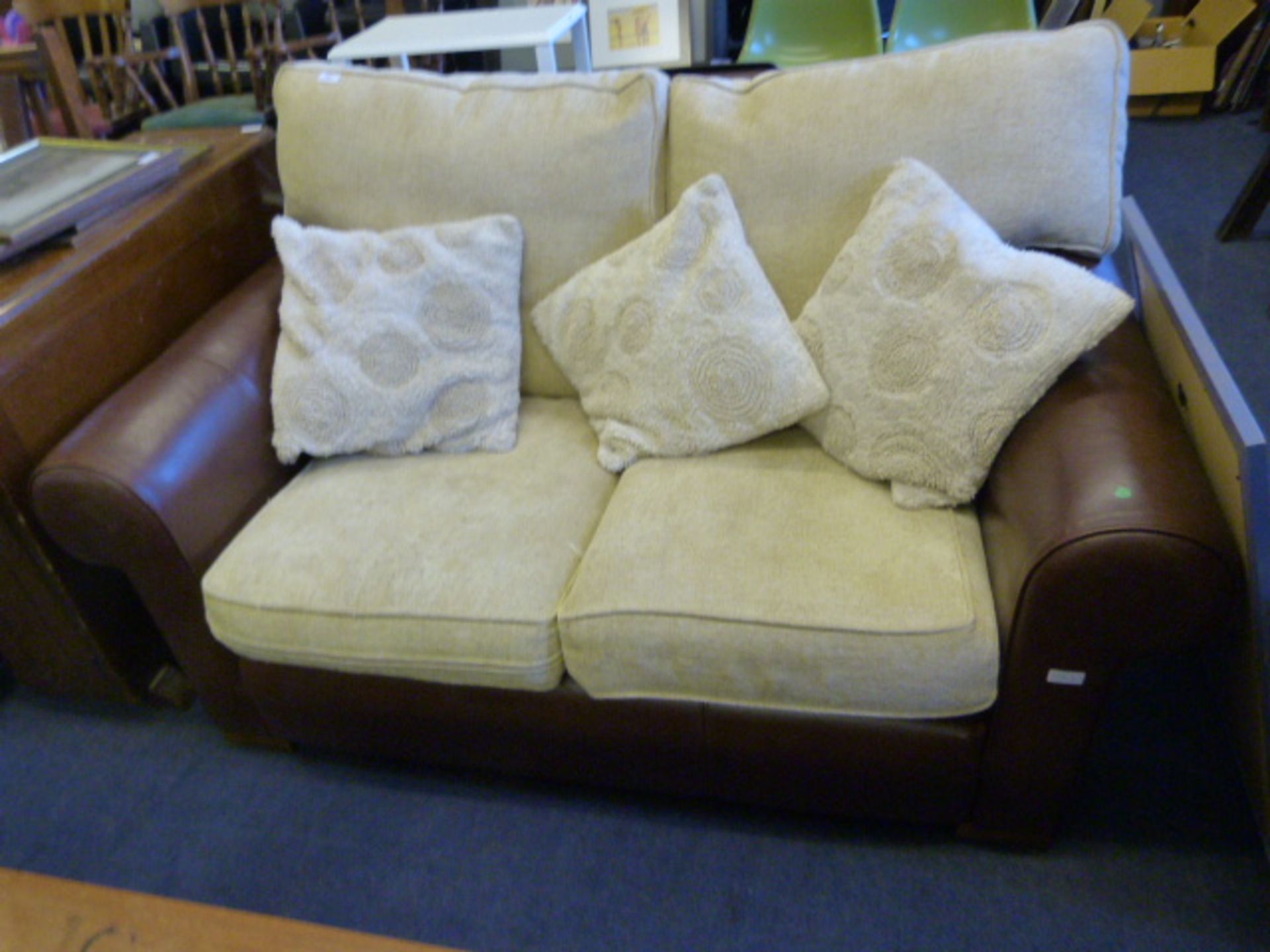 Brown Leather Two Seat Sofa with Cream Cushions