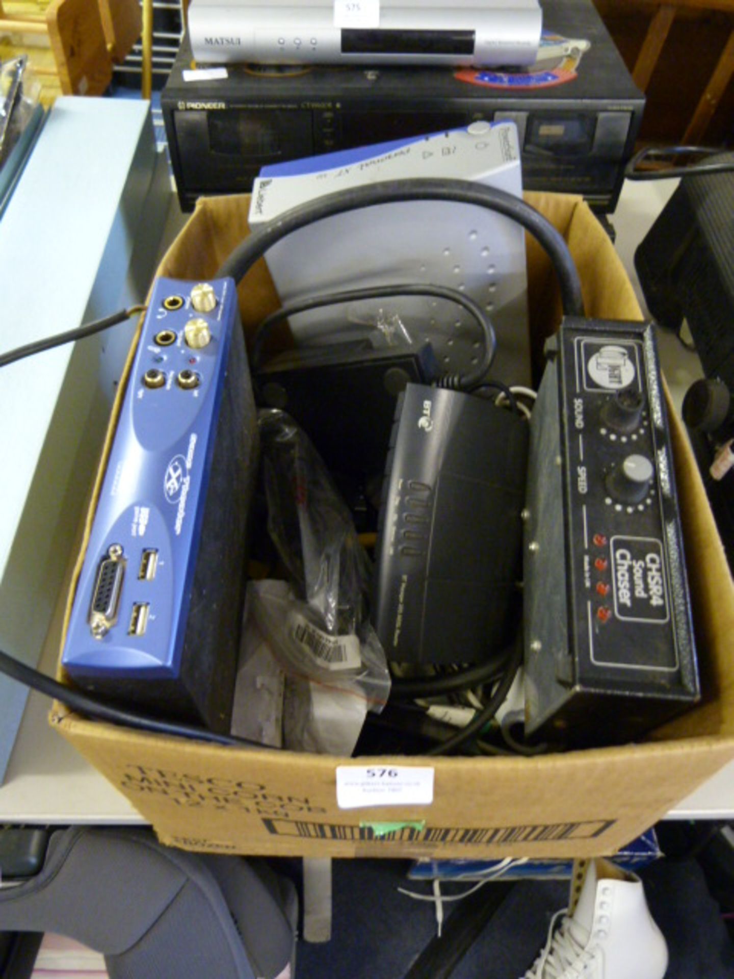Box Containing Sound Chaser, Game Theater, Router,