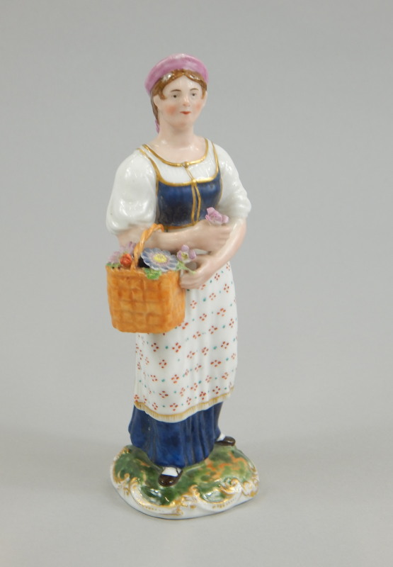 A 19thC Kornilov Brothers of St Petersburg Russian porcelain figure, modelled in the form of a