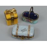 Three items of Limoges porcelain, to include a box and cover, modelled in the form of a suitcase,