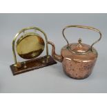 Two items of metalware, a Victorian copper and brass kettle, and a table gong engraved with a