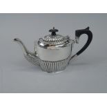 A silver part fluted tea for two sized teapot, Chester assay date letter indistinct, 6¾oz gross.