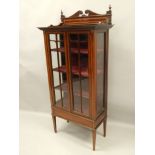 An Edwardian mahogany and satinwood cross banded display cabinet, with a raised back, above two