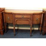 An early 19thC mahogany breakfront sideboard, with an arrangement of two central drawers, flanked by
