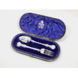 A Victorian silver christening set, comprising spoon and fork, London 1859, in fitted case,
