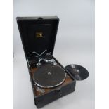 A portable gramophone player, and various 78 records. Provenance: Butterfields, Thoresby Park,