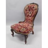 A Victorian mahogany spoon back chair, with a show frame, padded back and seat, on cabriole legs.