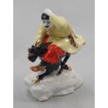 A Russian Lomonosov porcelain figure, in the form of a Cossack riding the devil, on a stylised