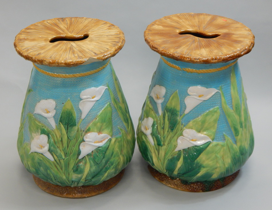 A pair of George Jones Victorian majolica garden seats, each decorated with lilies, leaves, etc,