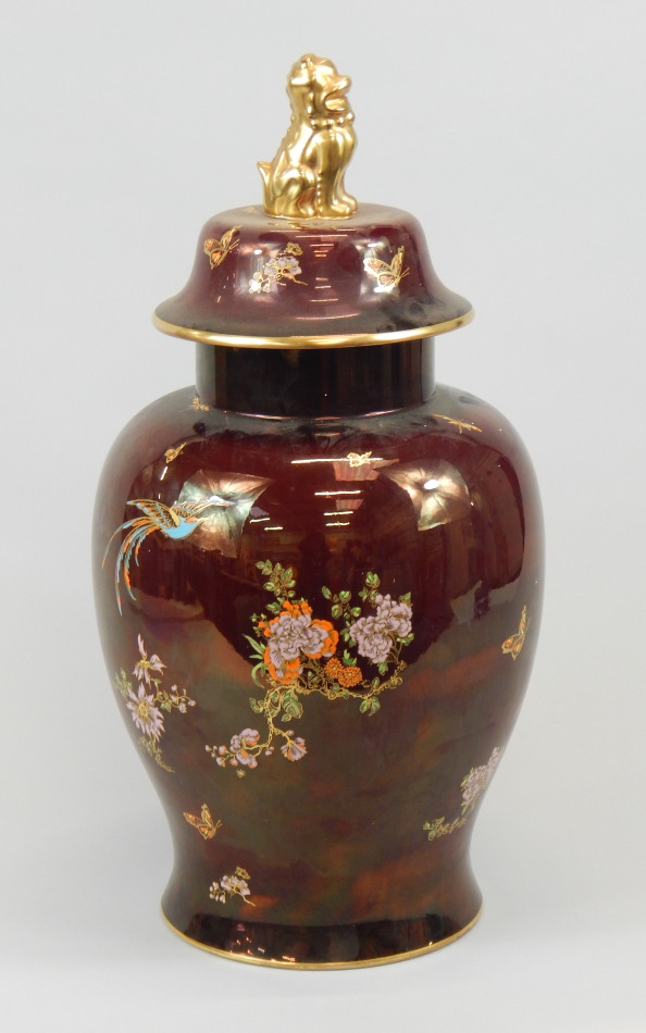 A Carltonware jar and cover, decorated in Oriental style with The Bird of Paradise and tree