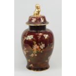 A Carltonware jar and cover, decorated in Oriental style with The Bird of Paradise and tree