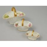 An associated set of three Royal Worcester porcelain baskets, each decorated with roses, printed