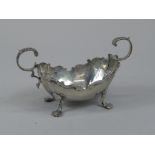 An Edwardian silver two handled sugar bowl, with four scroll feet, shaped border, Chester 1900, 4¾