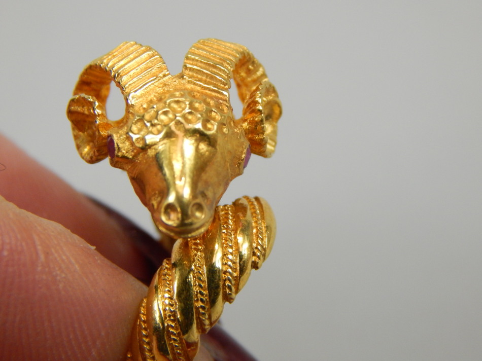 A ram's head ring, the head set with two rubies, yellow metal, marked 750, 9.1g all in. - Image 2 of 3