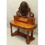 A Victorian mahogany Duchess type dressing table, the raised back with an oval plate, with an