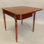 An early 19thC mahogany tea table, the rectangular top with rounded corners on turned tapering legs,