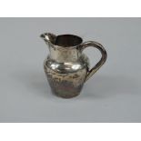 A late Victorian small silver cream jug, with plain handle, tapering form, Birmingham 1891, 1½oz.