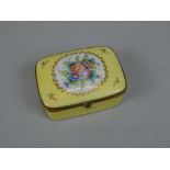 A Limoges porcelain box and cover, decorated centrally with a flower spray, on a yellow ground, 11cm