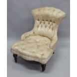 A Victorian mahogany nursing chair, elaborately upholstered in gold coloured floral damask, on