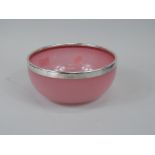 A pink Scottish style art glass bowl with silver collar, Birmingham 1919, 20cm diameter.