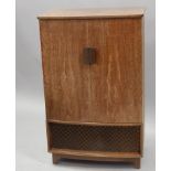 A Polydore radiogram, with Bakelite fittings, in a walnut cabinet, 60cm wide.