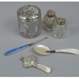 A collection of small silver, etc, to include two cut glass pepper pots, with silver mounts, a