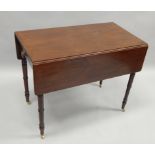 A 19thC mahogany Pembroke table, with a frieze drawer, on ring turned tapering legs and brass