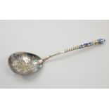 A Russian white metal champleve enamel spoon, the reverse of the bowl decorated with an eagle type