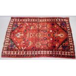 A Hamedan rug, with a design in red and cream, 205cm x 130cm